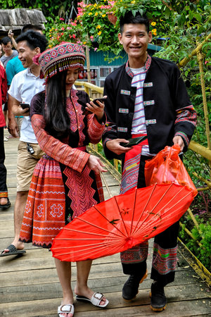 Sapa, Vietnam - August 23: Hmong couple on the main street on August 23, 2018 in Sapa, Vietnam.のeditorial素材