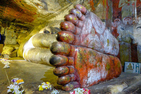 Dambulla, Sri Lanka - February 2020: Buddha statue inside Dambulla cave temple on February 8, 2020 in Dambulla, Sri Lanka. Cave I Devaraja Viharaya. Major attractions are spread over 5 caves, which contain statues and paintings.のeditorial素材