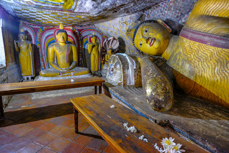 Dambulla, Sri Lanka - February 2020: Buddha statue inside Dambulla cave temple on February 8, 2020 in Dambulla, Sri Lanka. Cave V Devana Alut Viharaya. Major attractions are spread over 5 caves, which contain statues and paintings.のeditorial素材