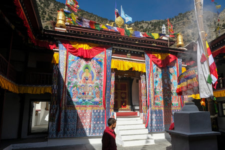 Marpha, Nepal - November 2021: Buddhist monk visiting the Marpha Buddhist monastery on November 3, 2021 in Marpha, Mustang District, Nepal.のeditorial素材