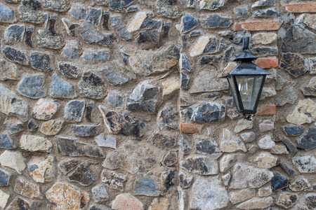 Street lamp on stone wallの写真素材