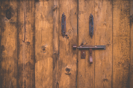 Old wood door with boltの写真素材