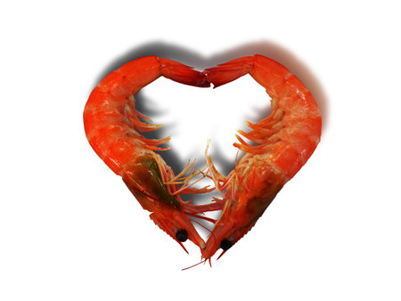 Close-up  top view of steamed prawns shripms setting as heart shape sign on the white background isolatedの写真素材