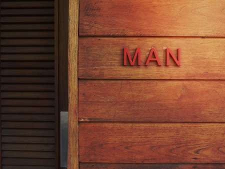 Red letter of MAN on the wooden wallの写真素材
