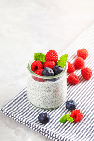 Chia pudding with fresh berries and almond milk. Superfood concept. Vegan, vegetarian and healthy eating diet with organic productsの写真素材