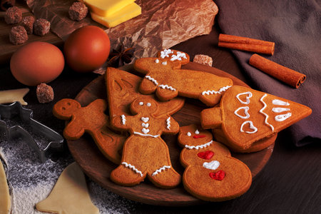 Plate with homemade Christmas cookies on rustic wood background, top viewの写真素材