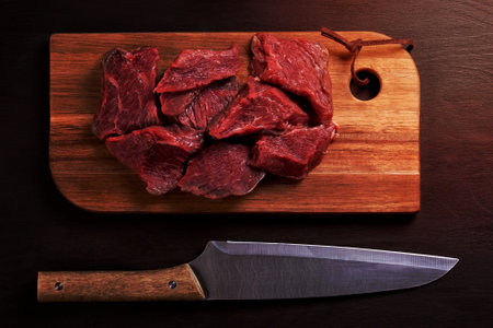 Raw fresh meat on wooden board ready for cookingの写真素材