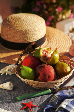 Summer vacation concept straw hat with sunglasses and fruitsの写真素材