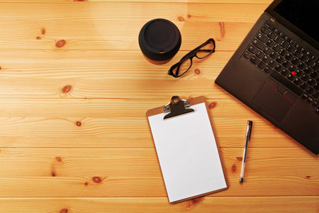 Top view over working place with laptop and office supplies. Copy space. Work organization, home office conceptの写真素材