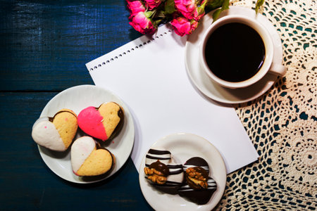 cup of coffee with flowers and note with place for text