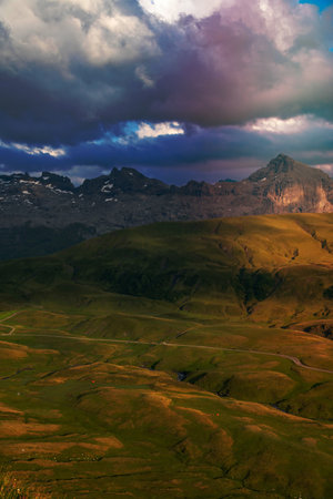 a big green mountain landscape with cloudy sky