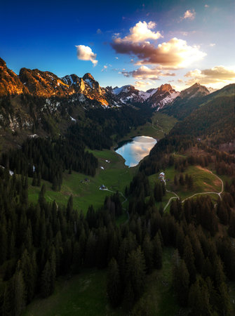 A mountain lake surrounded by forests mountainsの写真素材