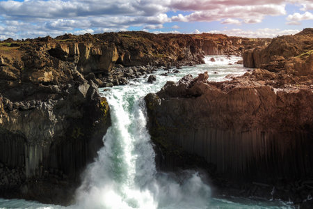 Iceland Aldeyjarfoss Scenery: A breathtaking stock photo of the Aldeyjarfoss waterfall, featuring...