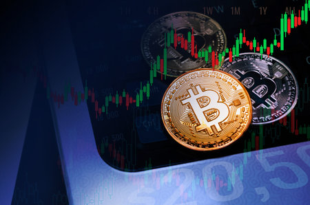 Bitcoin coins on trading graph of chart diagram,symbol of electronic virtual money and mining...