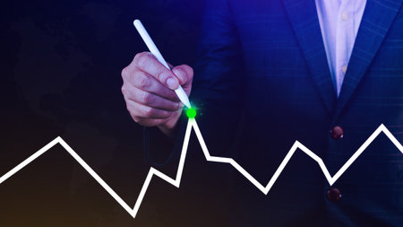 Businessman drawing growth curve, growth forecast chart, bussiness success concept. Hand drawing a graph representing increasing profits.の写真素材
