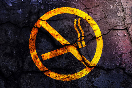 No smoking sign yellow with broken cement wall dark vintage style background âNo Smokingâの写真素材