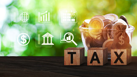 Wooden blocks with the words Tax and US dollar money bag and coins, Taxes payment concept. Tax evasion. Taxation. Business and finance.の写真素材