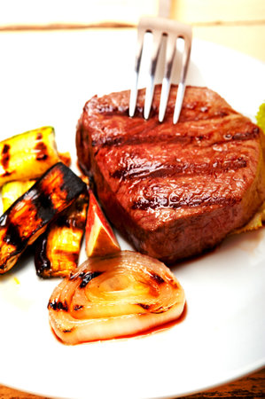 grilled fresh beef filet mignon and vegetablesの写真素材