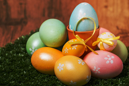 Colorful Easter eggs on grass background