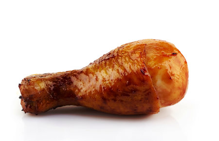 Roasted chicken leg on a white backgroundの写真素材