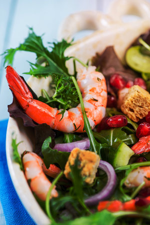 Fresh salad with shrimps and pomegranade seedsの写真素材
