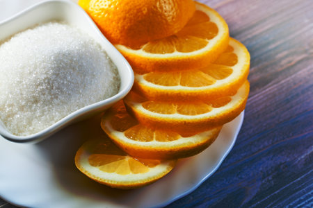 Fresh lemon with sugar on  white plateの写真素材