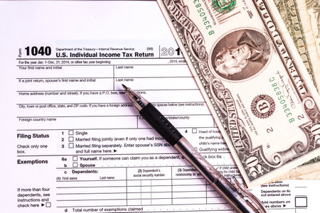 Tax form and Money. Filling the forms and hoping for a tax refund return
