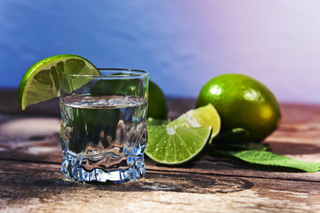 tequila and lime on a old wooden table