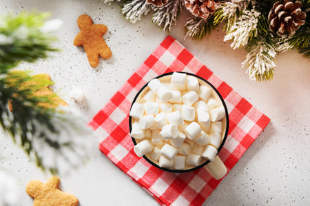Christmas coffee with marshmallow and Gingerbread man cookies on white background. Festive food for Xmas holiday with copy space.の写真素材