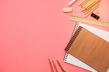 Colorful school supplies on pastel pink background. Top view, flat lay. Space for text.の写真素材