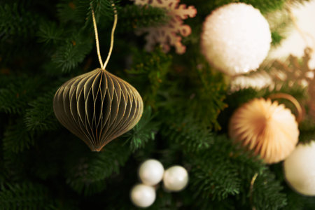 Decorated Christmas tree trendy green paper whirligig. Paper Diy decor. Xmas greeting card. Close up.の写真素材