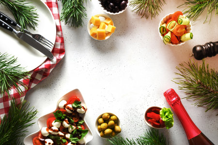 Concept of Christmas dinner with salads and various vegetables dishes for festive Xmas party on white table. View from above. Space for text.の写真素材