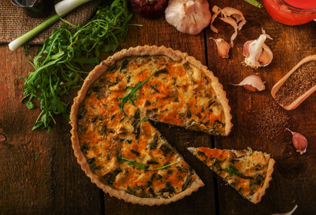cheese quiche with chicken arugula and mushroomsの写真素材