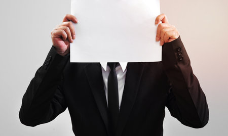 businessman acting show paper for something communicateの写真素材