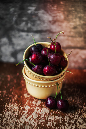 cherries on rustic wooden backgroundの写真素材