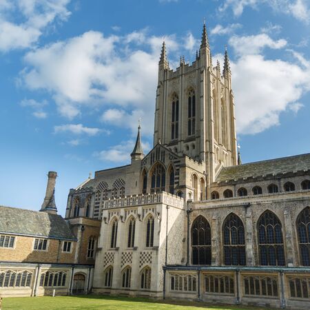 The Bury St Edmunds Cathedral in a sunny day in autumn. An ancient and big building with a large gardensの写真素材