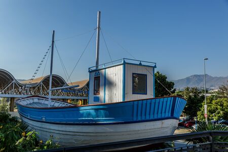 Beautiful boat of blue and white colors, in a sunny day