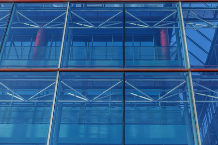 Front view of a large blue building of many windowsの写真素材