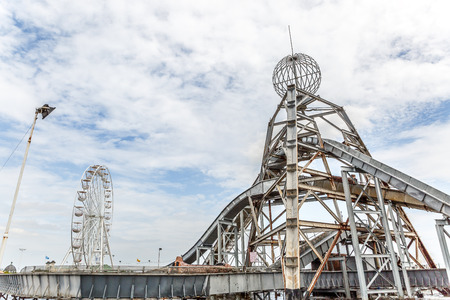 Water amusement park with a noria in the background, on a summer day in Great Yarmouth, UKの写真素材