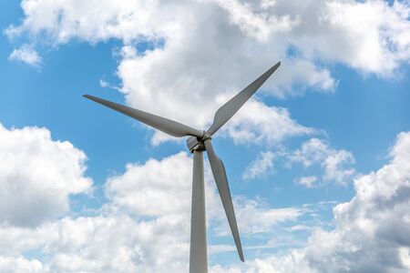 Close view of a large wind turbine for wind power on a sunny dayの写真素材