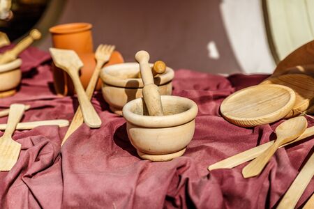 Wooden culinary items, displayed on a table at a vintage fairの写真素材