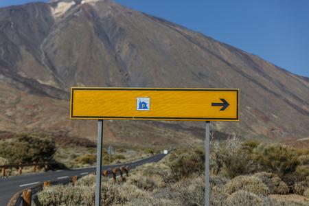 Yellow poster with the view of a large volcano in the backgroundの写真素材