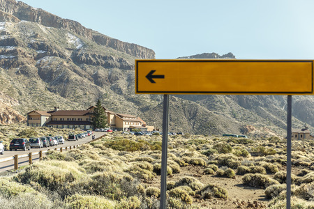 View of an outdoor parking and a building in the middle of a rocky and arid areaの写真素材