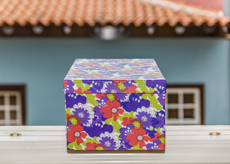 Gift box on the ledge of a window on a cold winter dayの写真素材