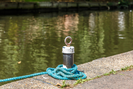 Small mooring with a blue rope on a small river in England, Norwichの写真素材