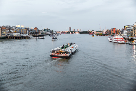 View at sunset of a luxury boat sailing on the River Thames. London, UKのeditorial素材