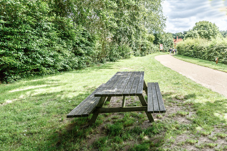 View of wooden benches to picnic and enjoy nature, in England