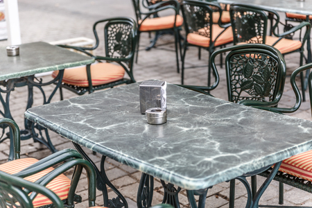 Tables and chairs outside a bar in Madrid, ready for customers, Spainの写真素材