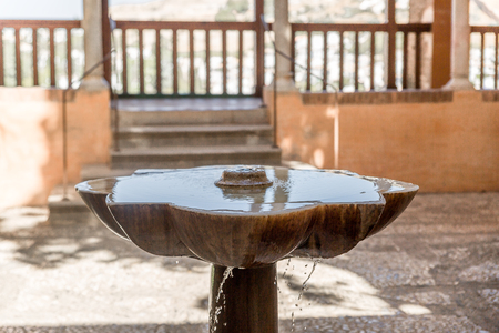 Water fountain in one of the buildings of the Alhambra, Granada, Spainの写真素材