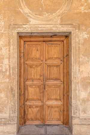 Classic solid wood door in one of the buildings of the Alhambra, Granada, Spainのeditorial素材